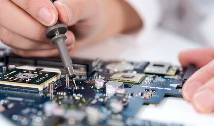 person working on a circuit board