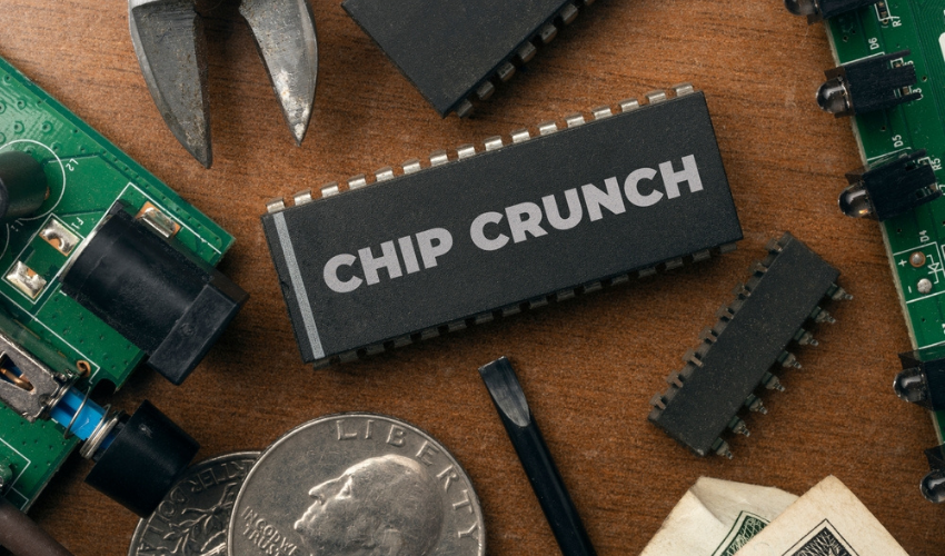 electronic chip with the words Chip Crunch across it